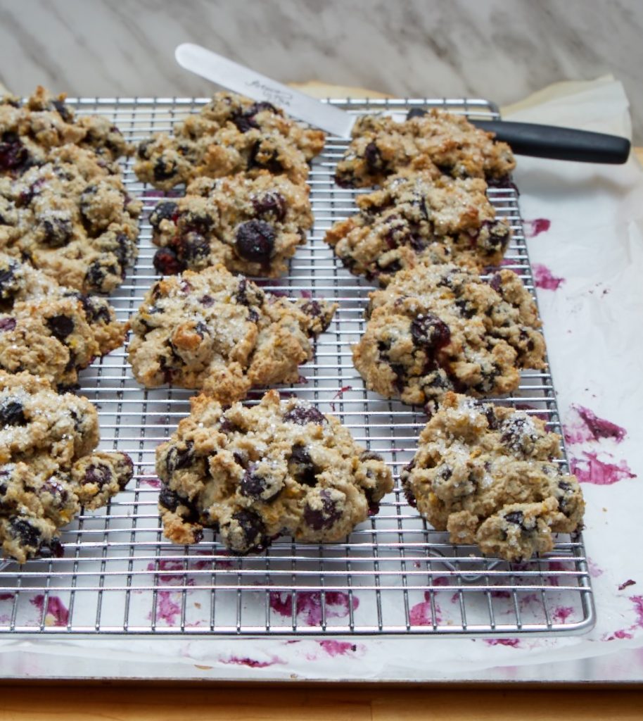 a tray of biscuits loaded with blueberries